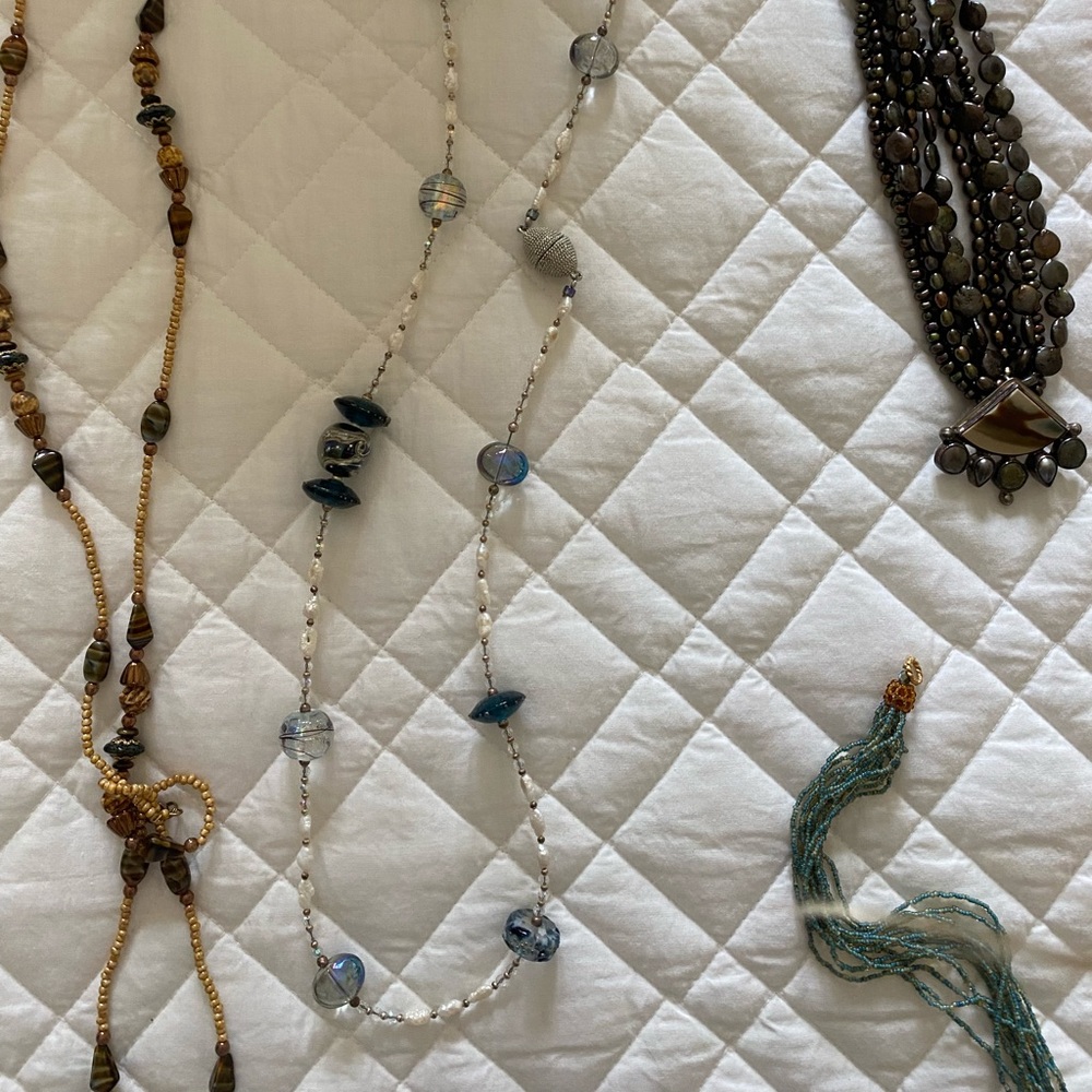 One white long necklace